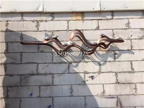 匠心雕琢 售樓部戶(hù)外不銹鋼藝術(shù)背景墻，激光圍邊與手工鍛造的藝術(shù)對(duì)話(huà)